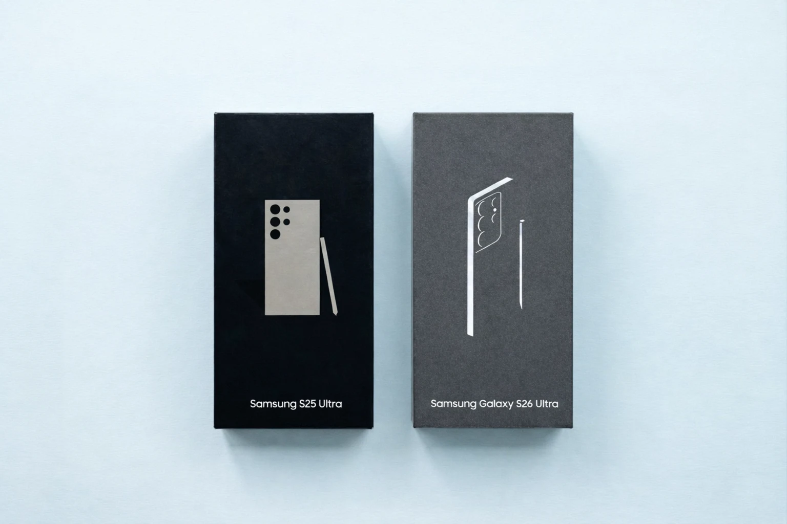 Comparison of the Samsung Galaxy S25 Ultra and the upcoming Samsung Galaxy S26 Ultra retail boxes side by side in the center of the frame.