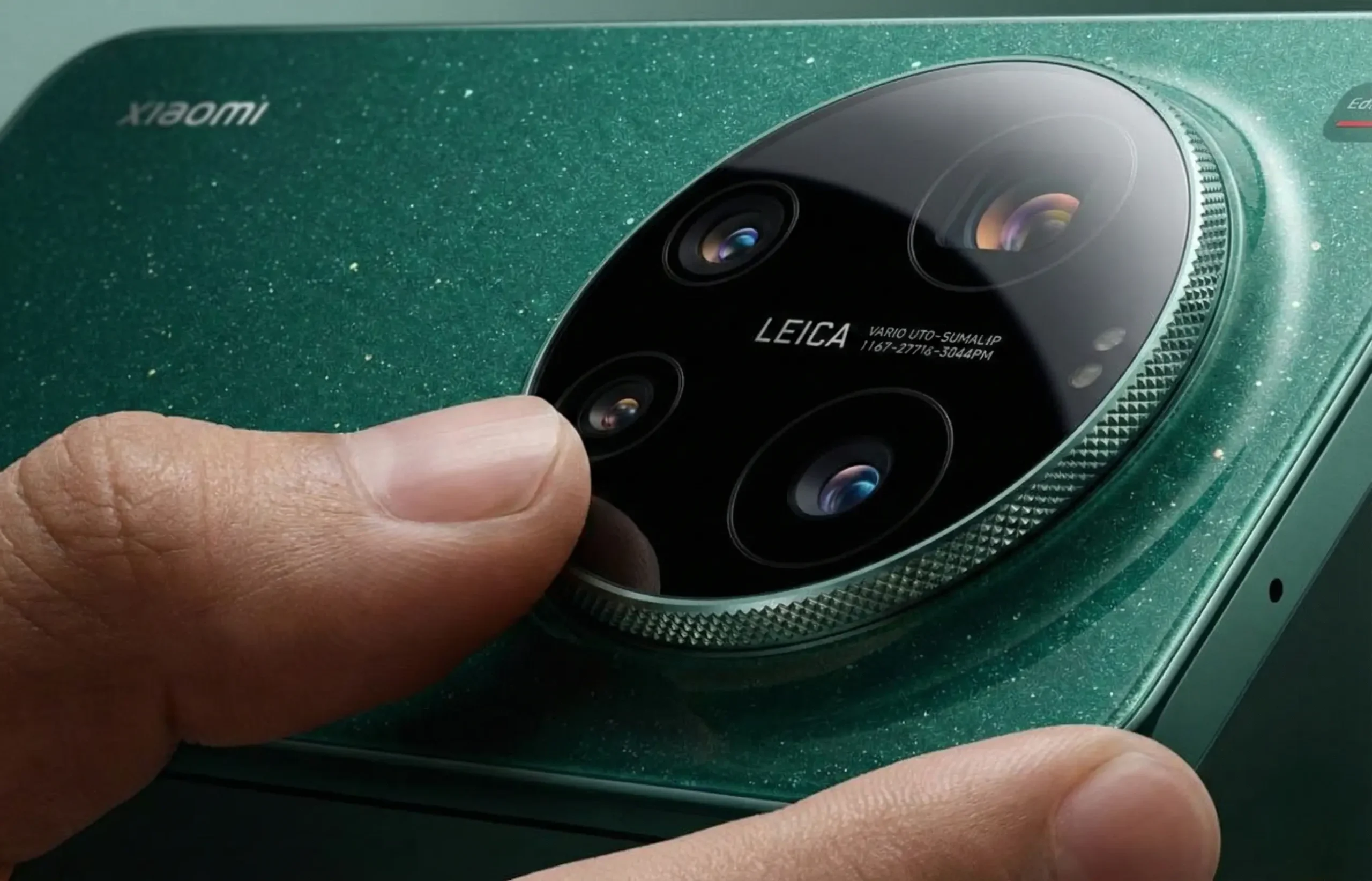 "Macro close-up of a thumb rotating the physical knurled metal Master Zoom Ring on the Xiaomi 17 Ultra Leica Edition camera module."