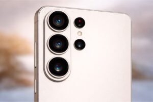 "Close-up macro image of the Samsung Galaxy S26 Ultra rear camera module showing three large circular lenses, additional sensors, and an LED flash on a matte silver back panel."