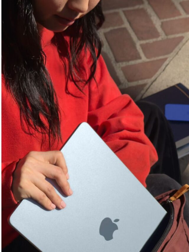 Student with the red hoodie packing her macbook in the bag-pack