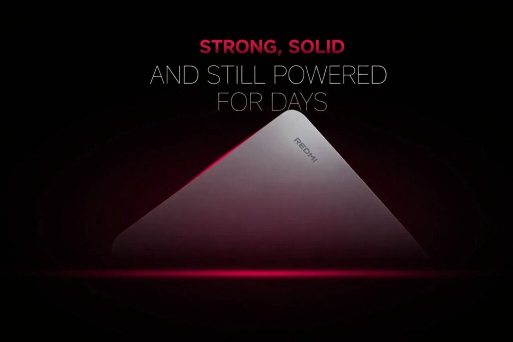 Close-up promotional image of a Redmi pad 2tablet showing a metal unibody design against a dark red and black background.