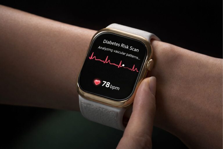 Close-up of a gold smartwatch on a wrist displaying a “Diabetes Risk Scan” screen with an ECG waveform, the message “Analyzing vascular patterns…” and a heart rate reading of 78 bpm.