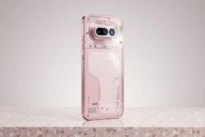 Pink Nothing Phone rear design with dual camera module and transparent back panel on minimal background.