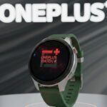OnePlus Watch 4 smartwatch product render with green strap and round display