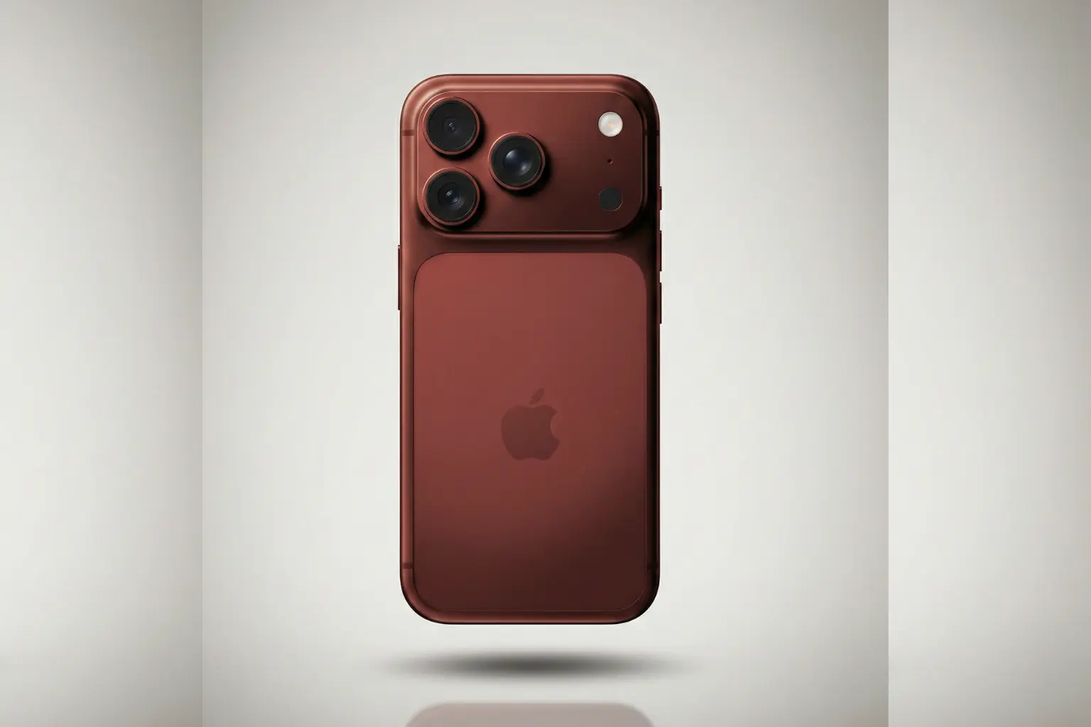 "A photorealistic studio hero shot of a dark red concept iPhone viewed from the back. The phone features a matte finish, a large camera module with three lenses, and the Apple logo, hovering over a faint floor reflection against a clean, light-gray gradient background."