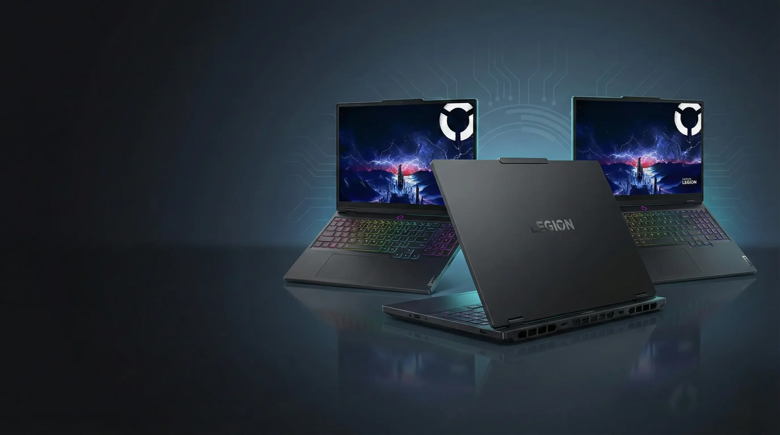 "Three 2026 Lenovo Legion gaming laptops displayed in a high-tech studio setting with realistic reflections and a dark charcoal-to-blue gradient background."