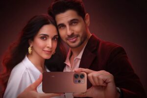 Couple holding a Vivo smartphone highlighting its ZEISS triple-camera setup.