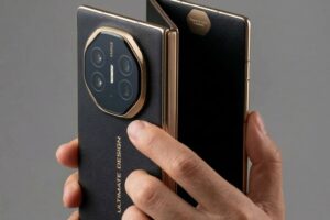 Huawei Mate XT tri fold smartphone held in hand showing hinge and camera design