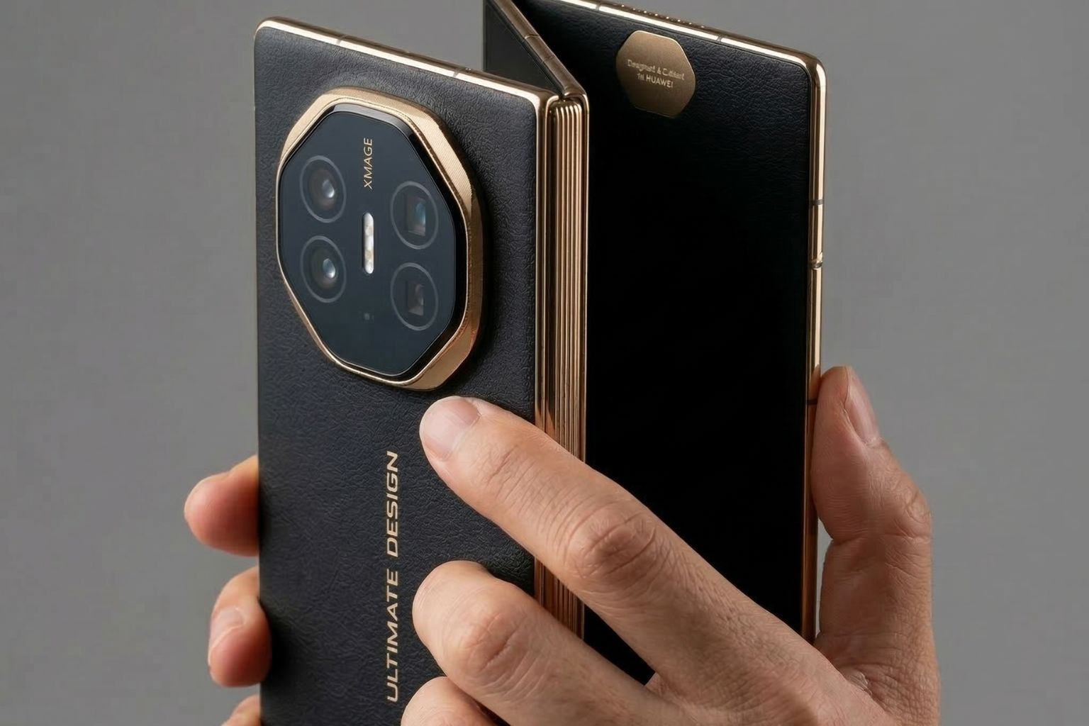 Huawei Mate XT tri fold smartphone held in hand showing hinge and camera design