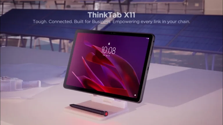 Lenovo ThinkTab X11 rugged tablet on a desk stand with a stylus, set against a backdrop of solar panels.