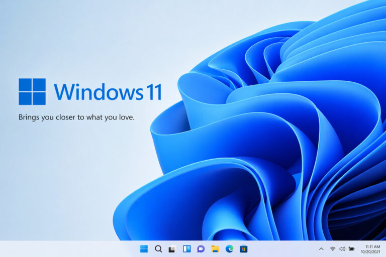 Windows 11 wallpaper with blue swirl and centered taskbar.”